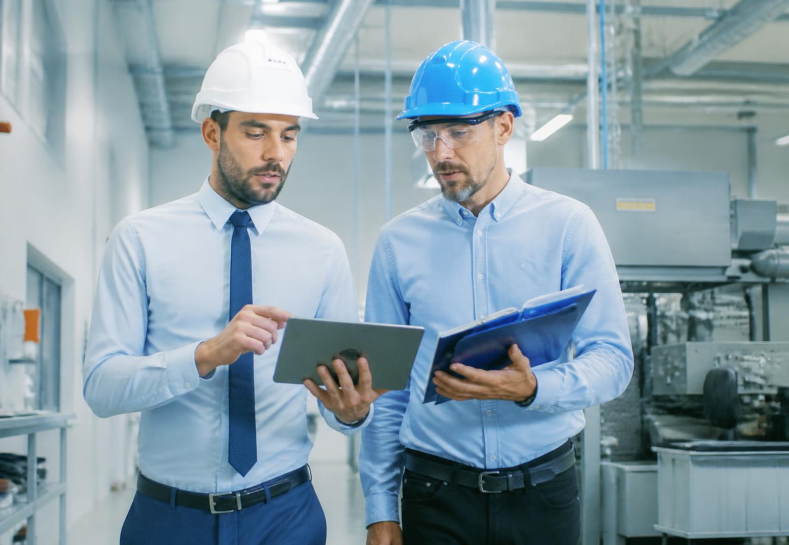 Mechlytix consultants reviewing production performance data with plant engineers
